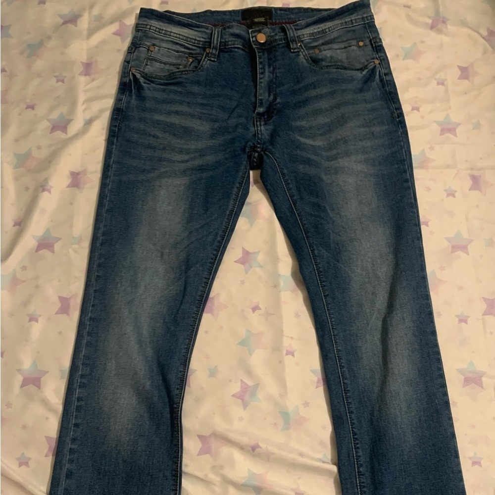 Steve's Jeans Men's stretch denim jeans in blue, size 30/32. Made in China.